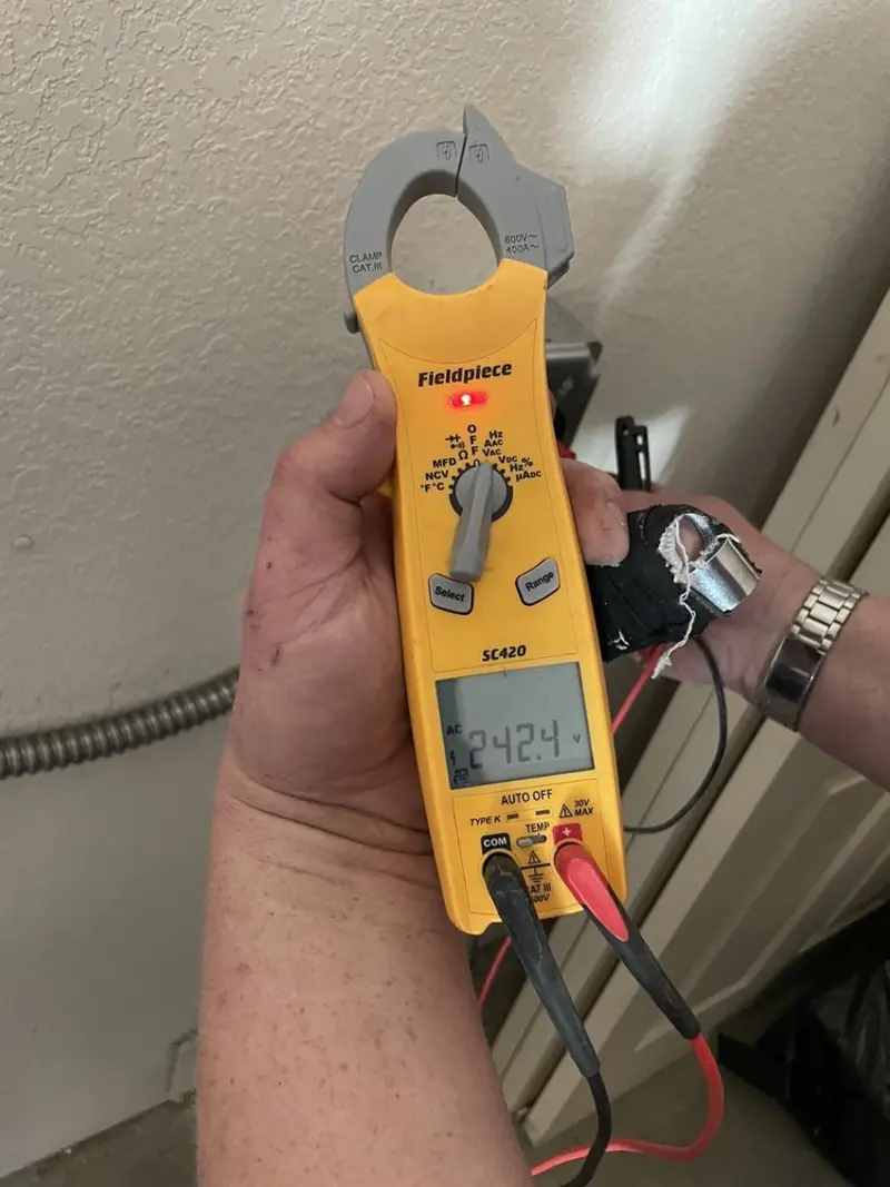 Voltage testing with clamp meter during Outlet Installation in Livermore